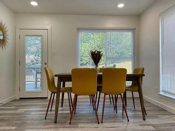 2502 Tracy Cove Leander, TX 78641 - Photo 5 of 34 a view of a dining room with furniture window and wooden floor