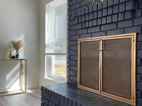 a kitchen with stainless steel appliances a stove sink microwave and cabinets