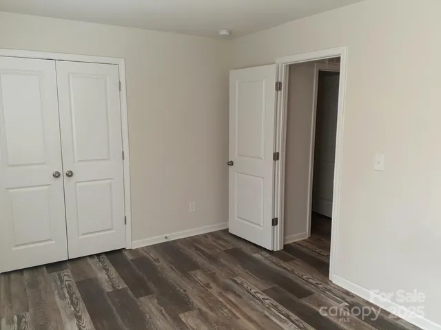 an empty room with wooden floor