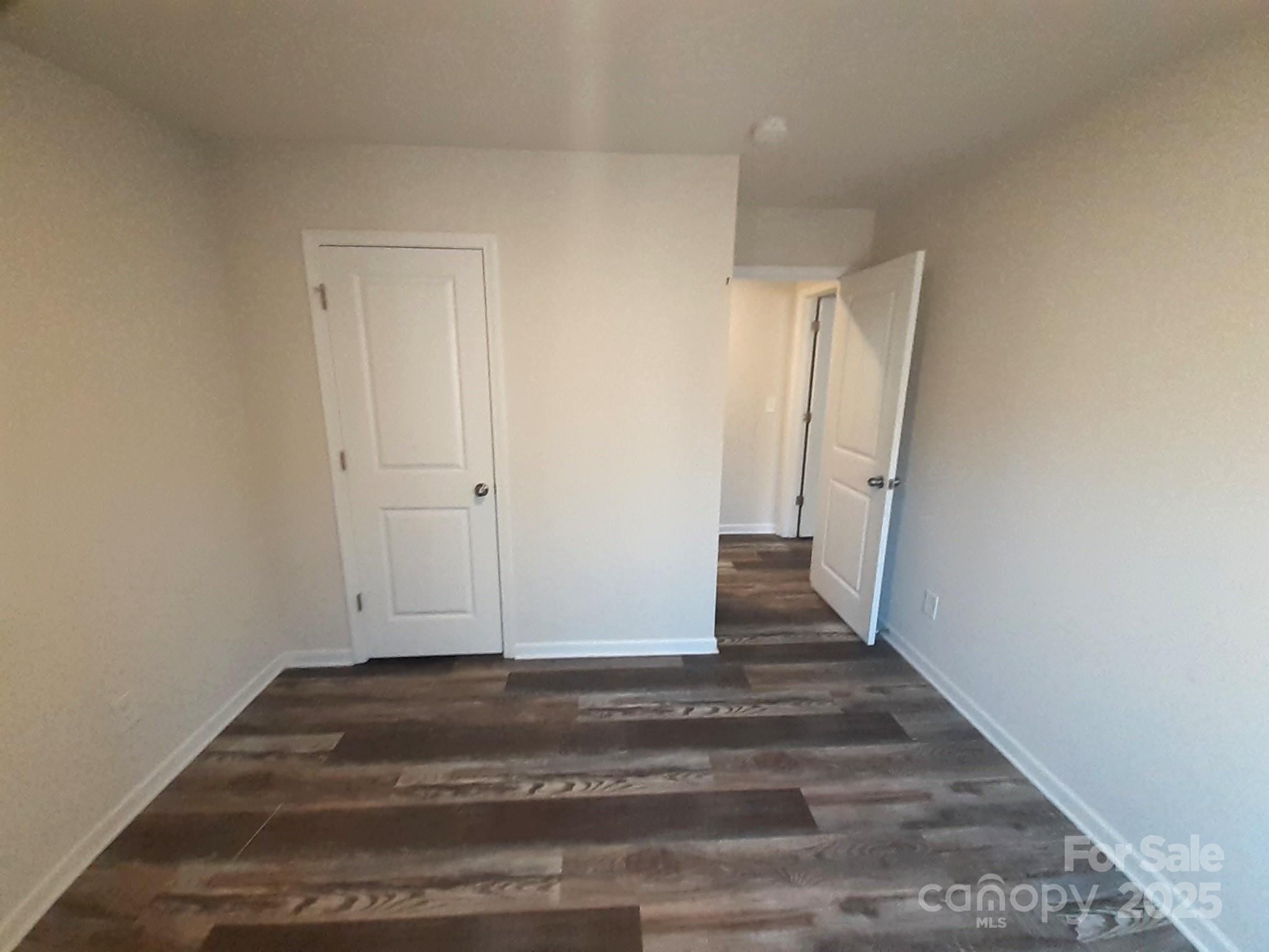 3944 Wade E Morgan Road Charlotte, NC 28269 - Photo 17 of 20 a view of room with wooden floor