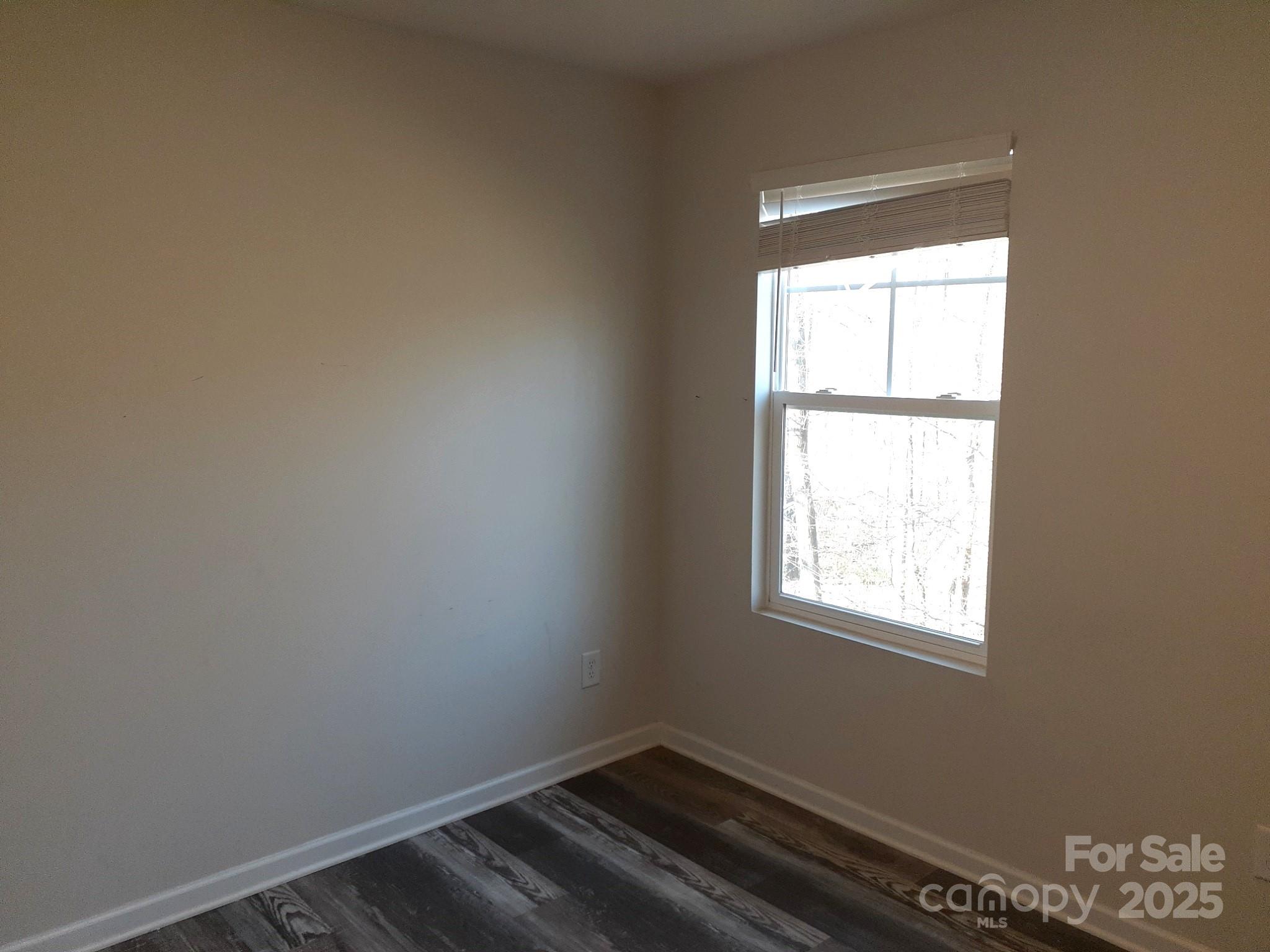 3944 Wade E Morgan Road Charlotte, NC 28269 - Photo 18 of 20 an empty room with a window