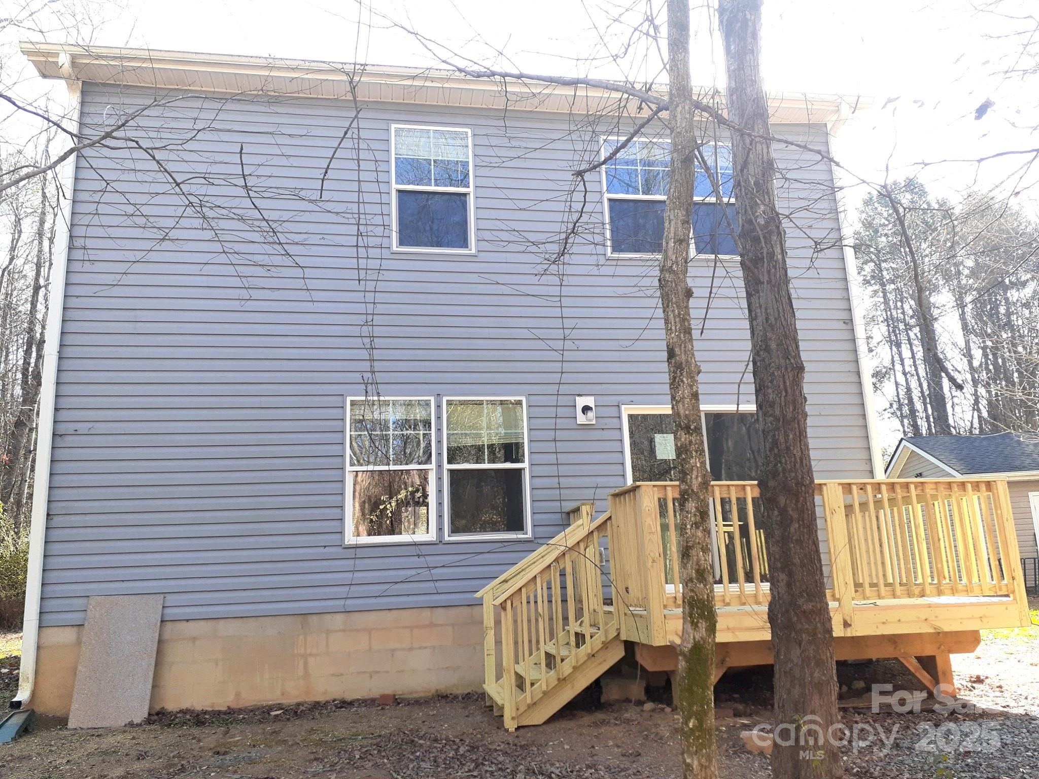 3944 Wade E Morgan Road Charlotte, NC 28269 - Photo 20 of 20 a view of a house with a deck