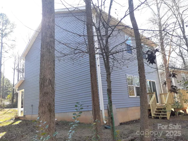 a view of a back yard of the house