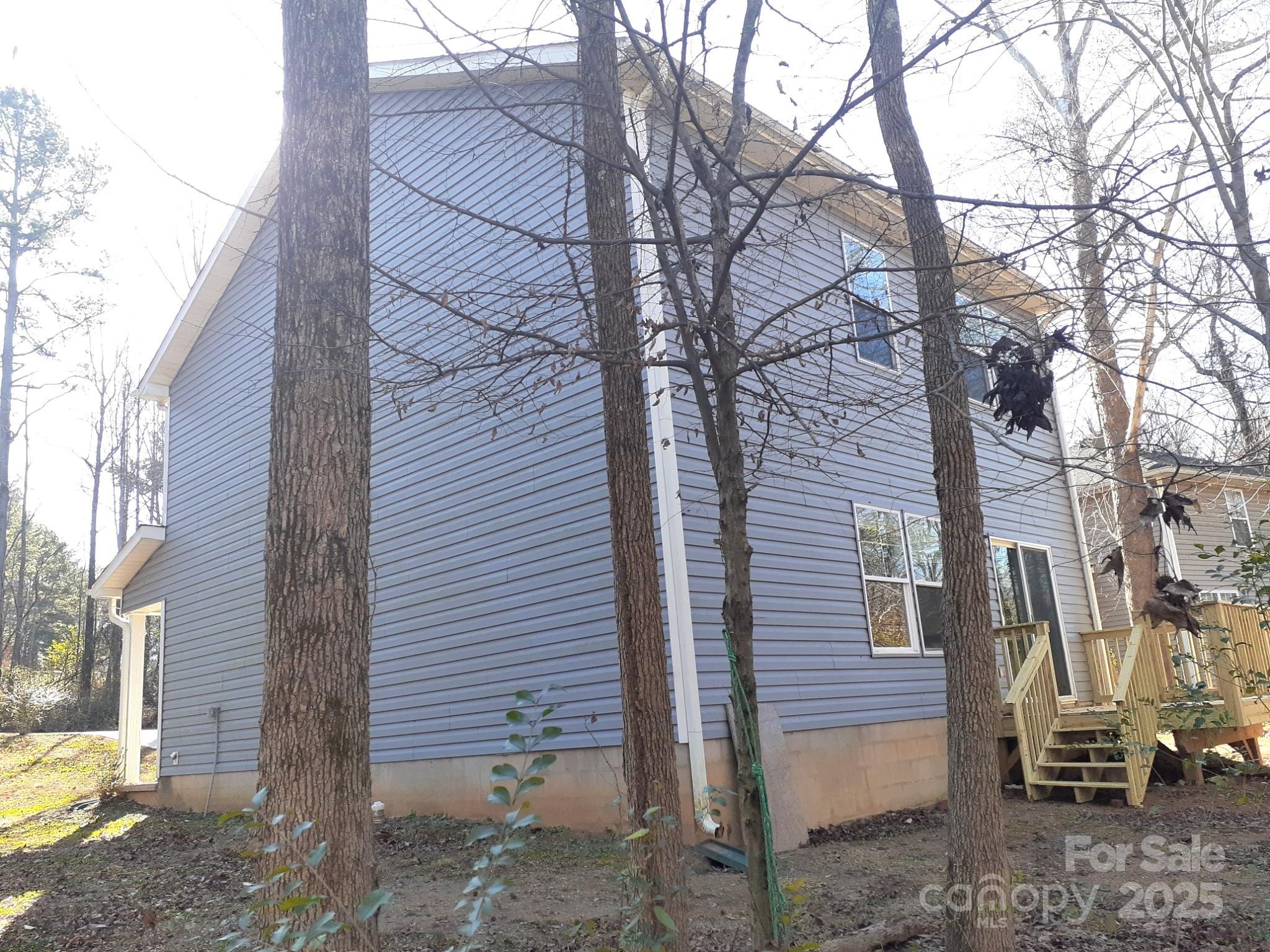 3944 Wade E Morgan Road Charlotte, NC 28269 - Photo 4 of 20 a view of a back yard of the house