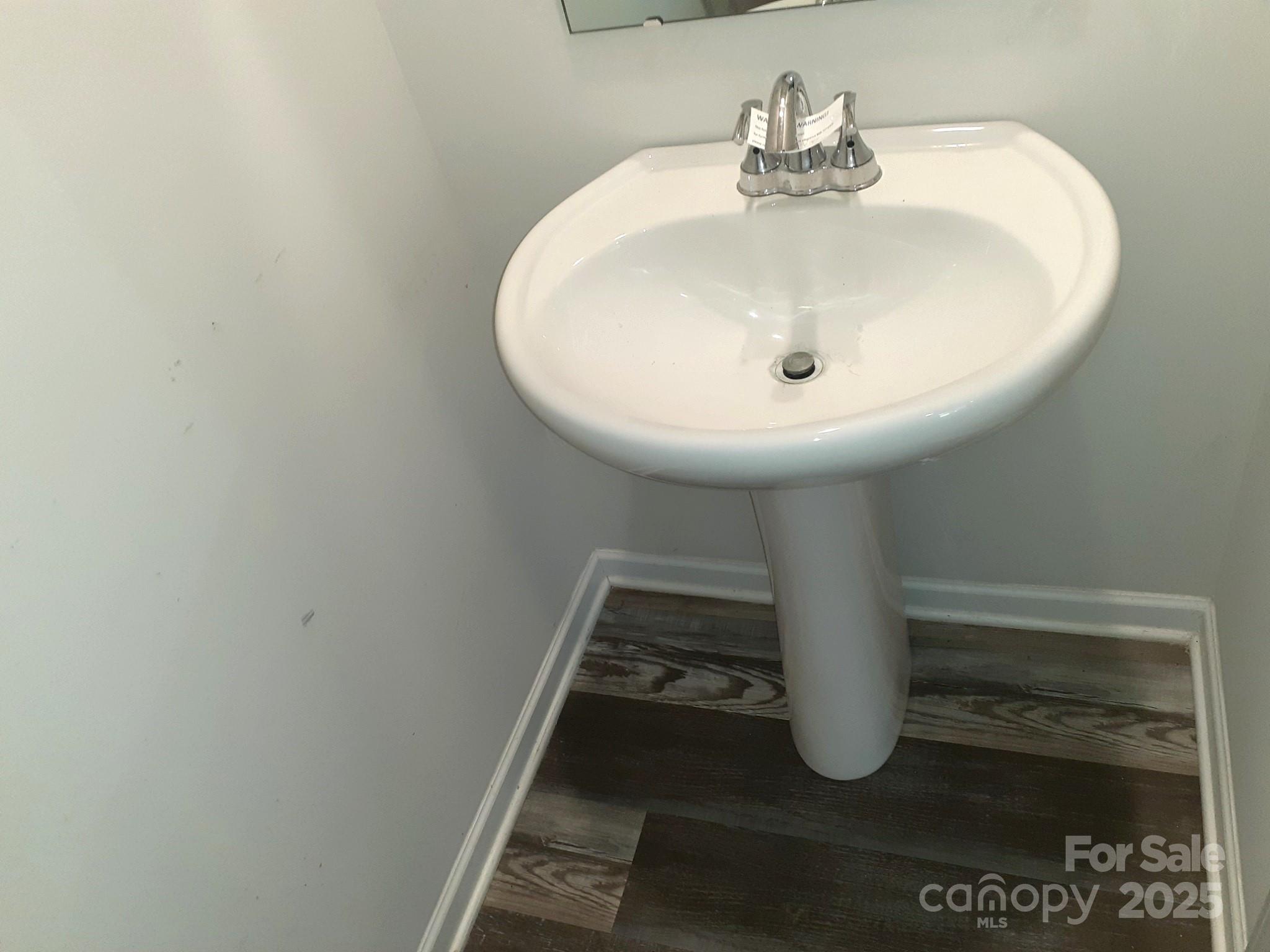 3944 Wade E Morgan Road Charlotte, NC 28269 - Photo 10 of 20 a bathroom with a sink