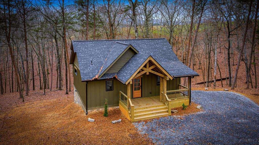 2393 Ada Street Blue Ridge, GA 30513 - Photo 1 of 56 a view of a house with a yard and wooden fence
