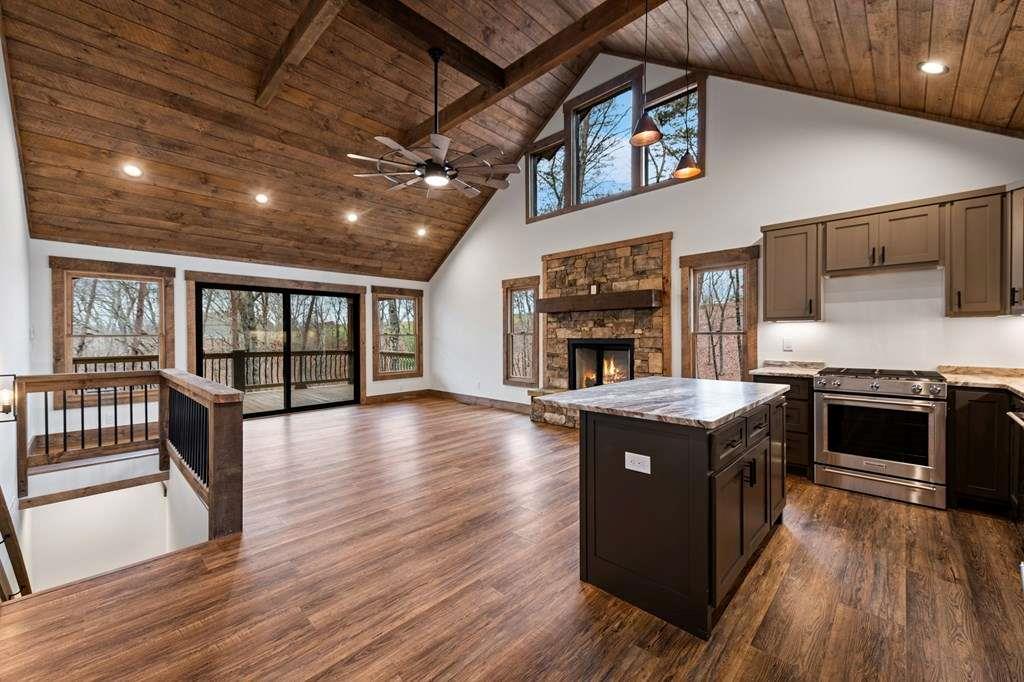 2393 Ada Street Blue Ridge, GA 30513 - Photo 12 of 56 a kitchen with stainless steel appliances granite countertop a stove and a wooden floors