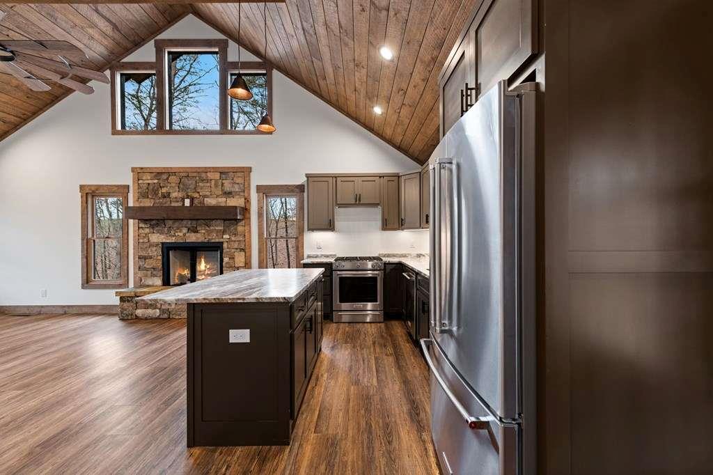 2393 Ada Street Blue Ridge, GA 30513 - Photo 13 of 56 a kitchen with granite countertop stainless steel appliances and wooden floor