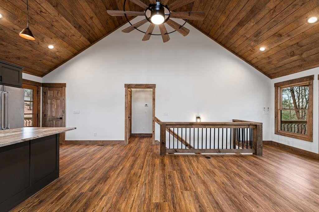 2393 Ada Street Blue Ridge, GA 30513 - Photo 14 of 56 a view of an empty room with wooden floor and a window