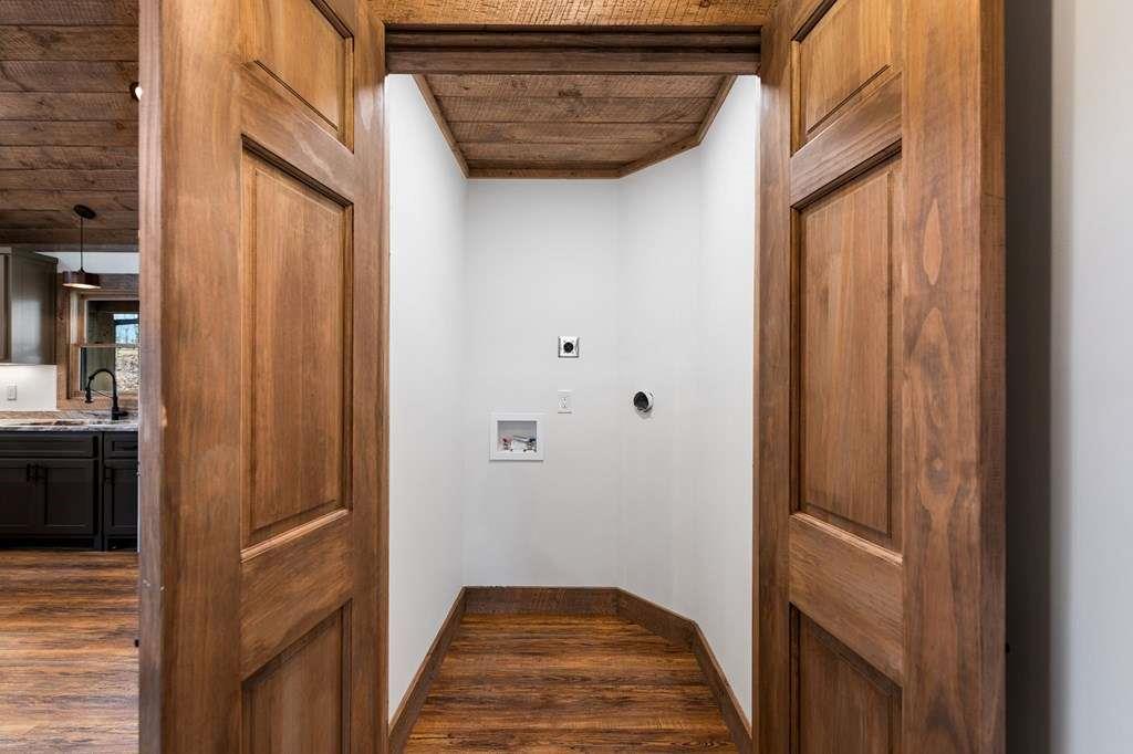 2393 Ada Street Blue Ridge, GA 30513 - Photo 17 of 56 a view of a hallway with wooden floor and staircase