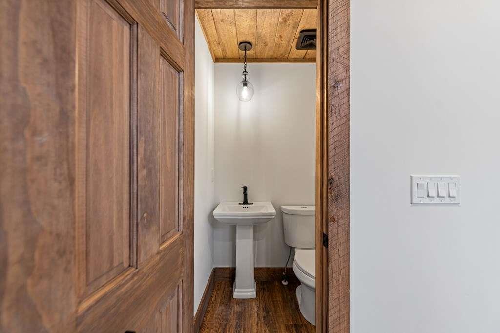 2393 Ada Street Blue Ridge, GA 30513 - Photo 19 of 56 a view of a bathroom with a sink and mirror