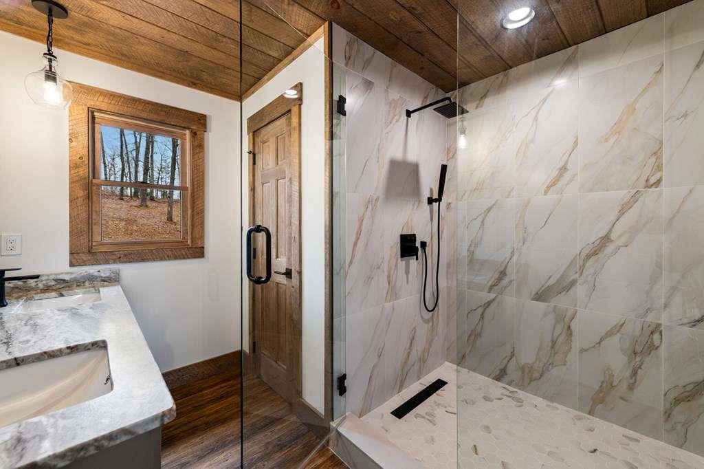 2393 Ada Street Blue Ridge, GA 30513 - Photo 26 of 56 a bathroom with a sink and shower