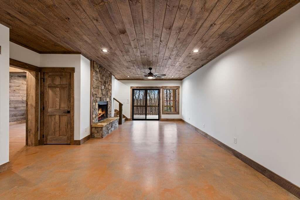 2393 Ada Street Blue Ridge, GA 30513 - Photo 29 of 56 a view of an empty room with wooden floor and a window