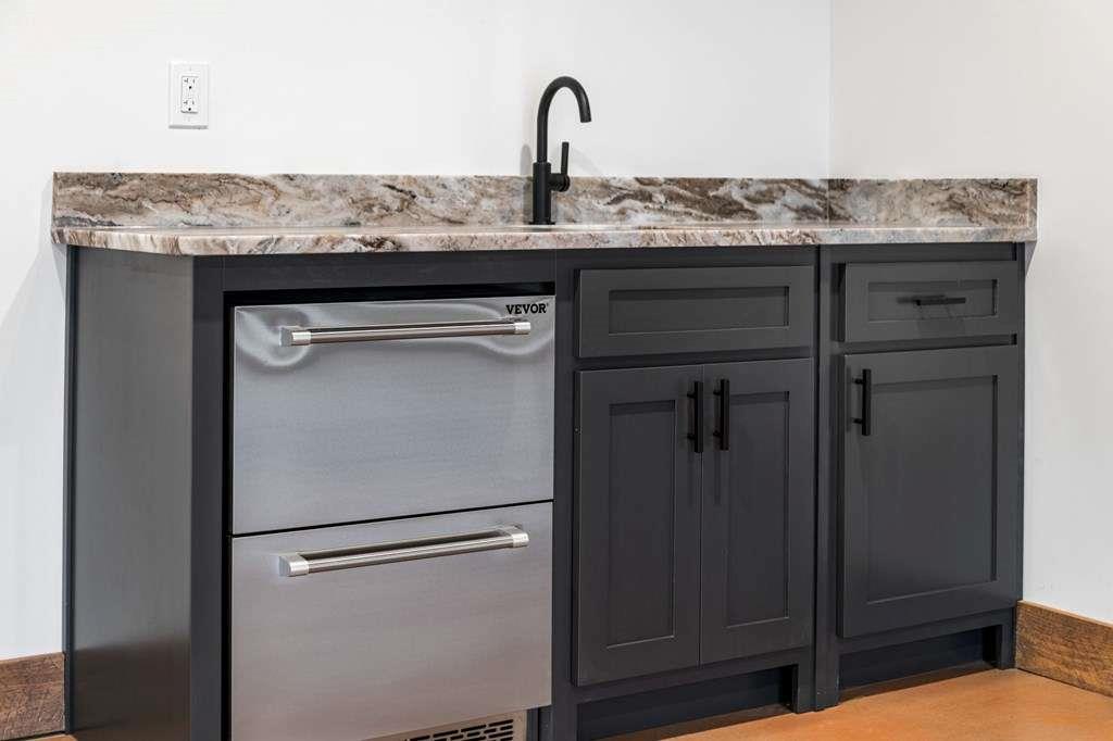 2393 Ada Street Blue Ridge, GA 30513 - Photo 35 of 56 a close view of a sink and a dishwasher in a kitchen