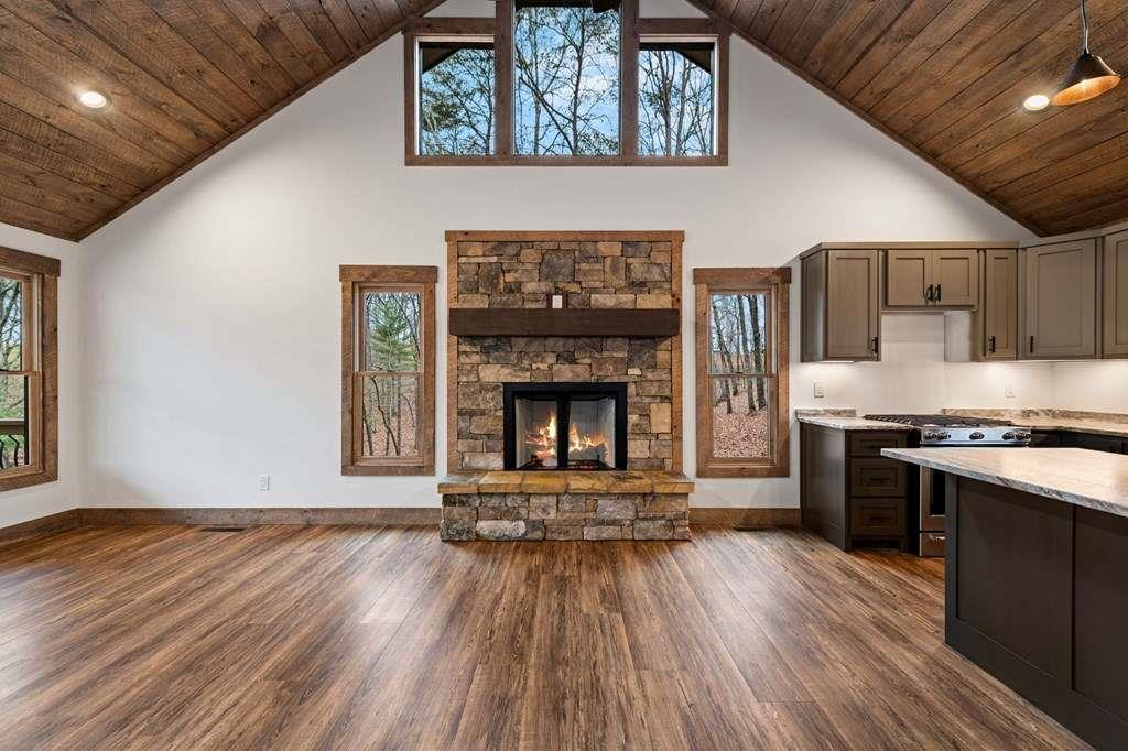 2393 Ada Street Blue Ridge, GA 30513 - Photo 5 of 56 a living room with stainless steel appliances wooden floor and a fireplace
