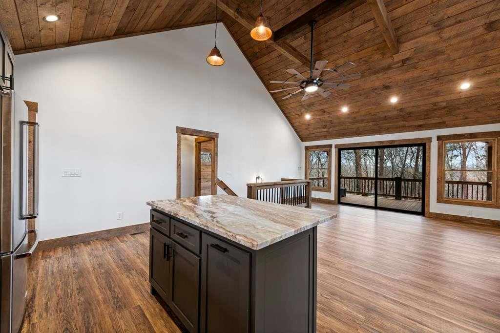 2393 Ada Street Blue Ridge, GA 30513 - Photo 9 of 56 a kitchen with a wooden floor and window