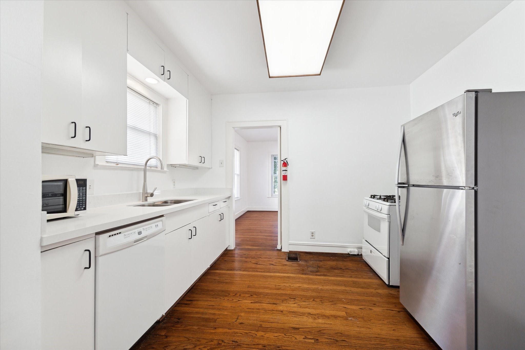 2309 Wroxton Road Houston, TX 77005 - Photo 12 of 15 a kitchen with granite countertop a refrigerator and a sink