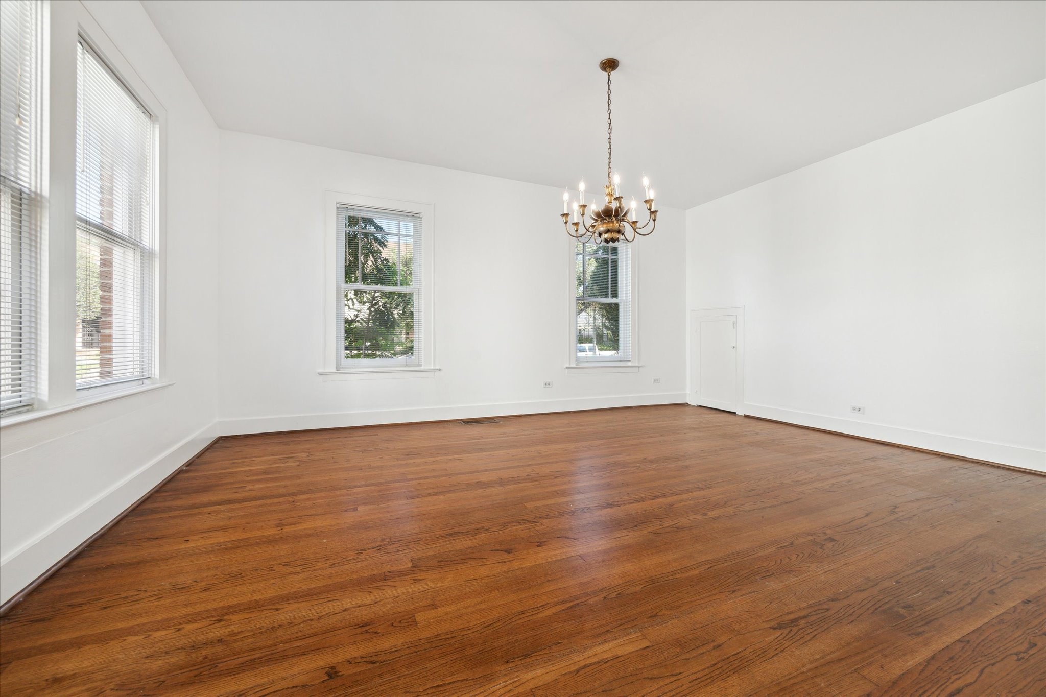 2309 Wroxton Road Houston, TX 77005 - Photo 13 of 15 a view of empty room with wooden floor and window