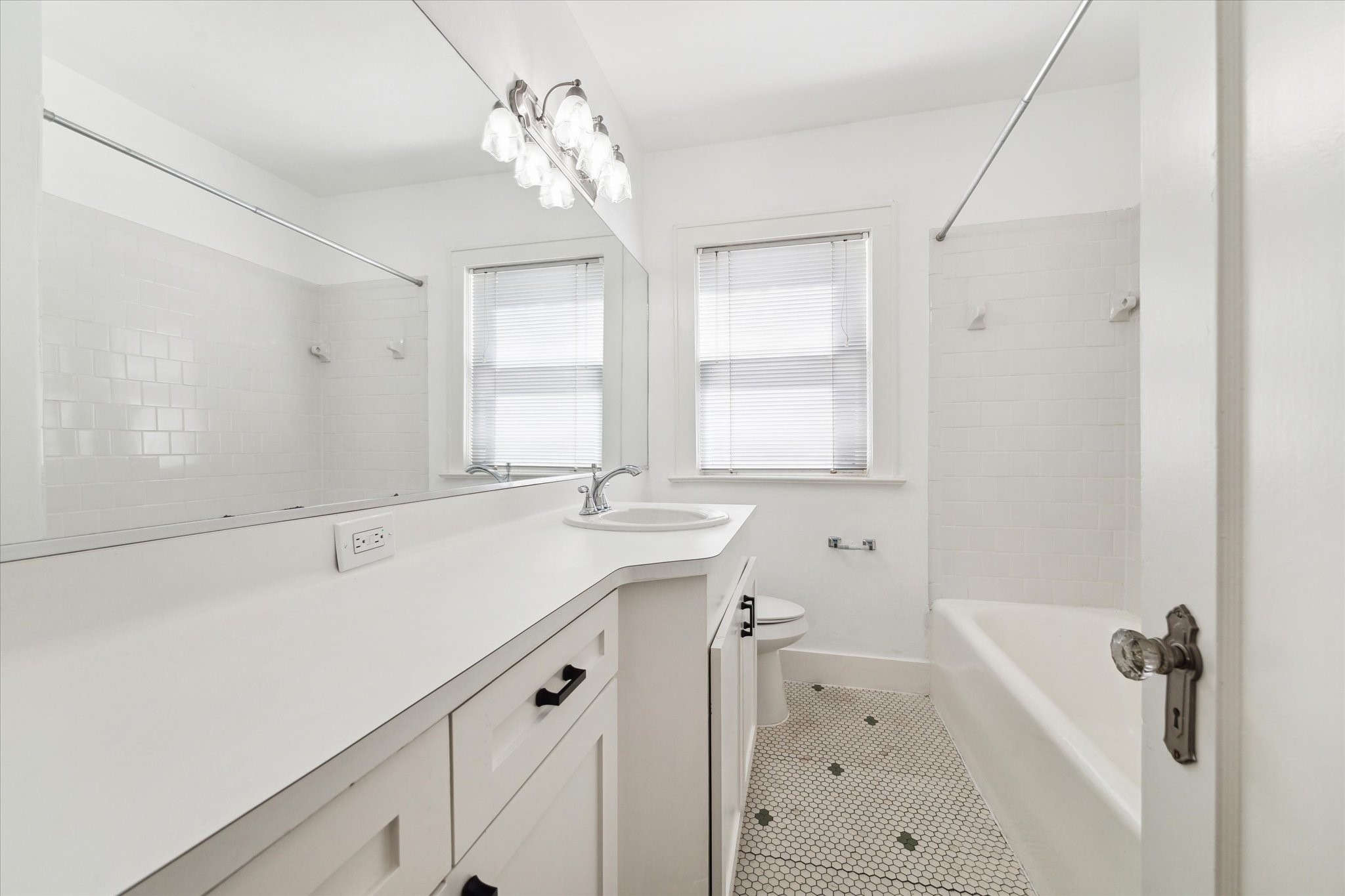 2309 Wroxton Road Houston, TX 77005 - Photo 7 of 15 a bathroom with a sink double vanity and a bathtub