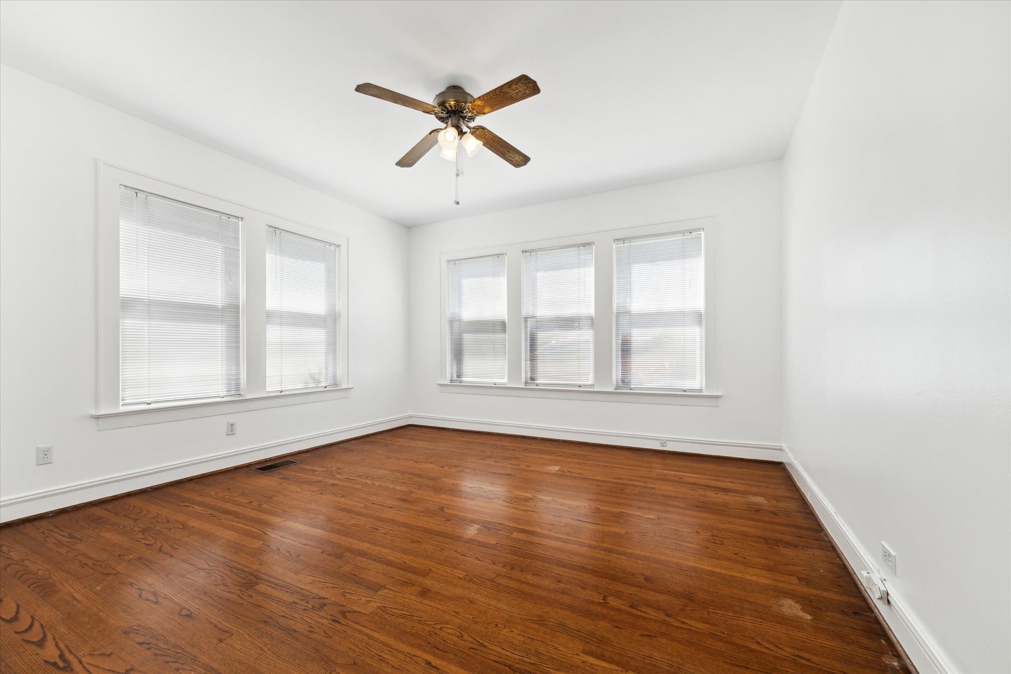 2309 Wroxton Road Houston, TX 77005 - Photo 8 of 15 a view of empty room with wooden floor and fan