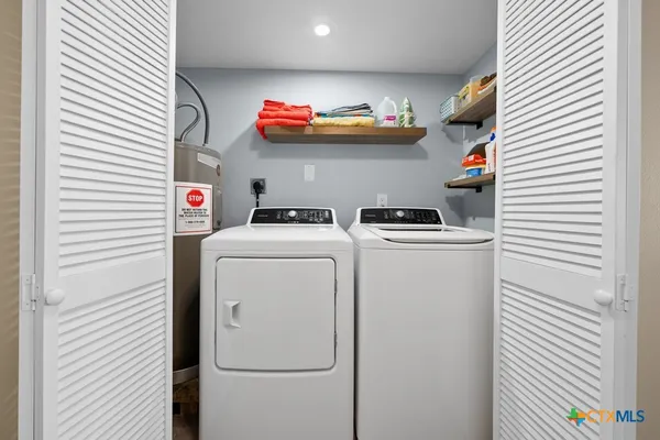 a utility room with dryer and washer