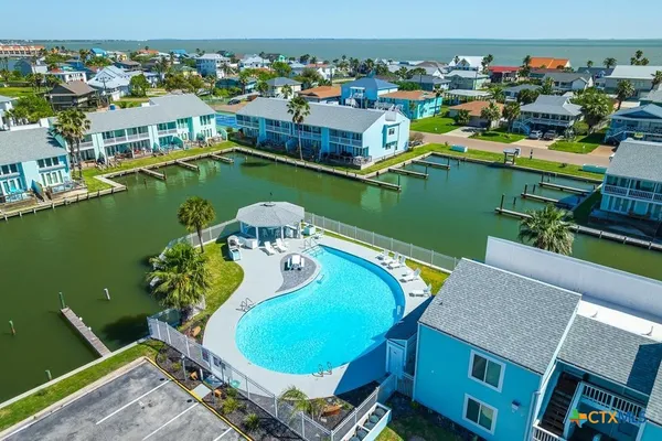 an aerial view of a house with outdoor space