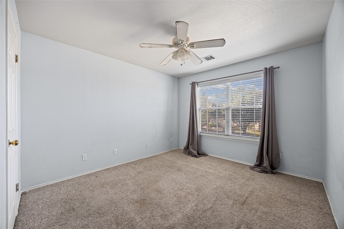 1321 Bunratty Circle Pflugerville, TX 78660 - Photo 25 of 31 Unfurnished room with carpet floors and a ceiling fan