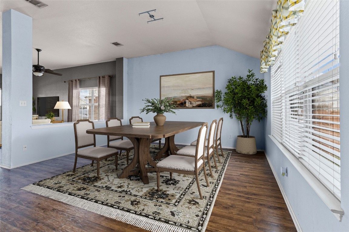 1321 Bunratty Circle Pflugerville, TX 78660 - Photo 6 of 31 Dining area with lofted ceiling and dark wood-style floors