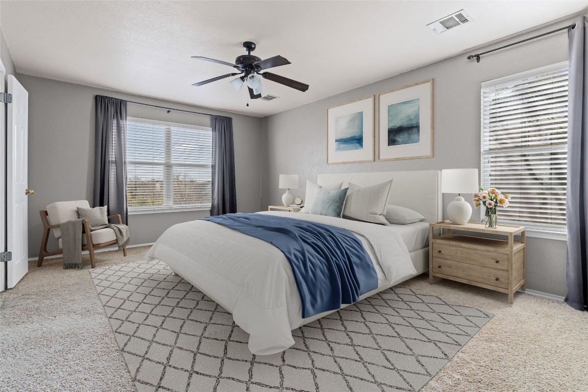 1321 Bunratty Circle Pflugerville, TX 78660 - Photo 10 of 31 Bedroom with ceiling fan, multiple windows, and light carpet