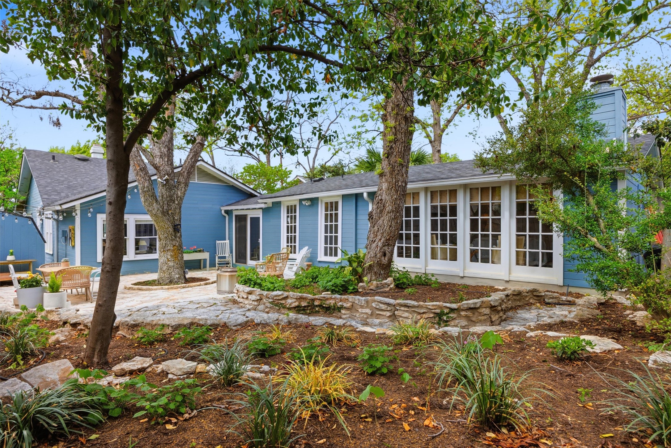1507 Wethersfield Road Austin, TX 78703 - Photo 39 of 40 Mature trees and terraced landscaping enhance this charming home's inviting outdoor spaces.