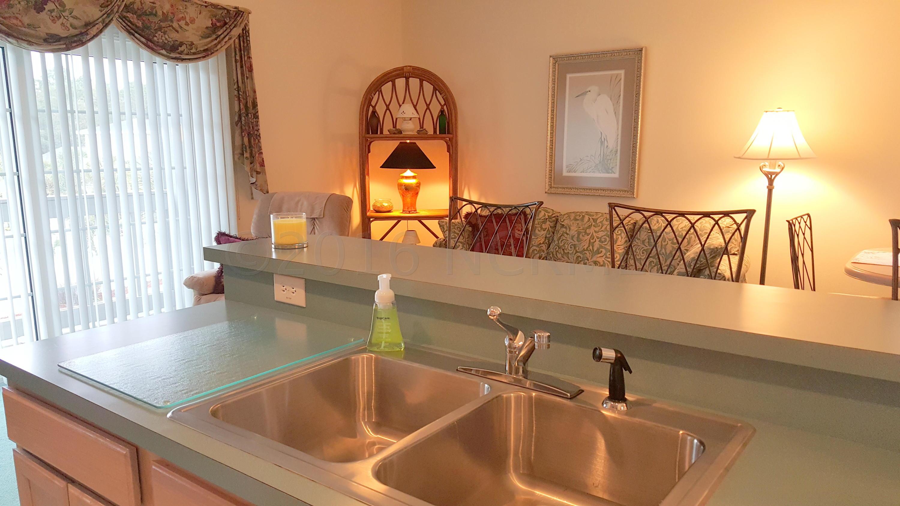 225 Royal Poste Road, Unit 2606 Sunset Beach, NC 28468 - Photo 8 of 28 Kitchen to living