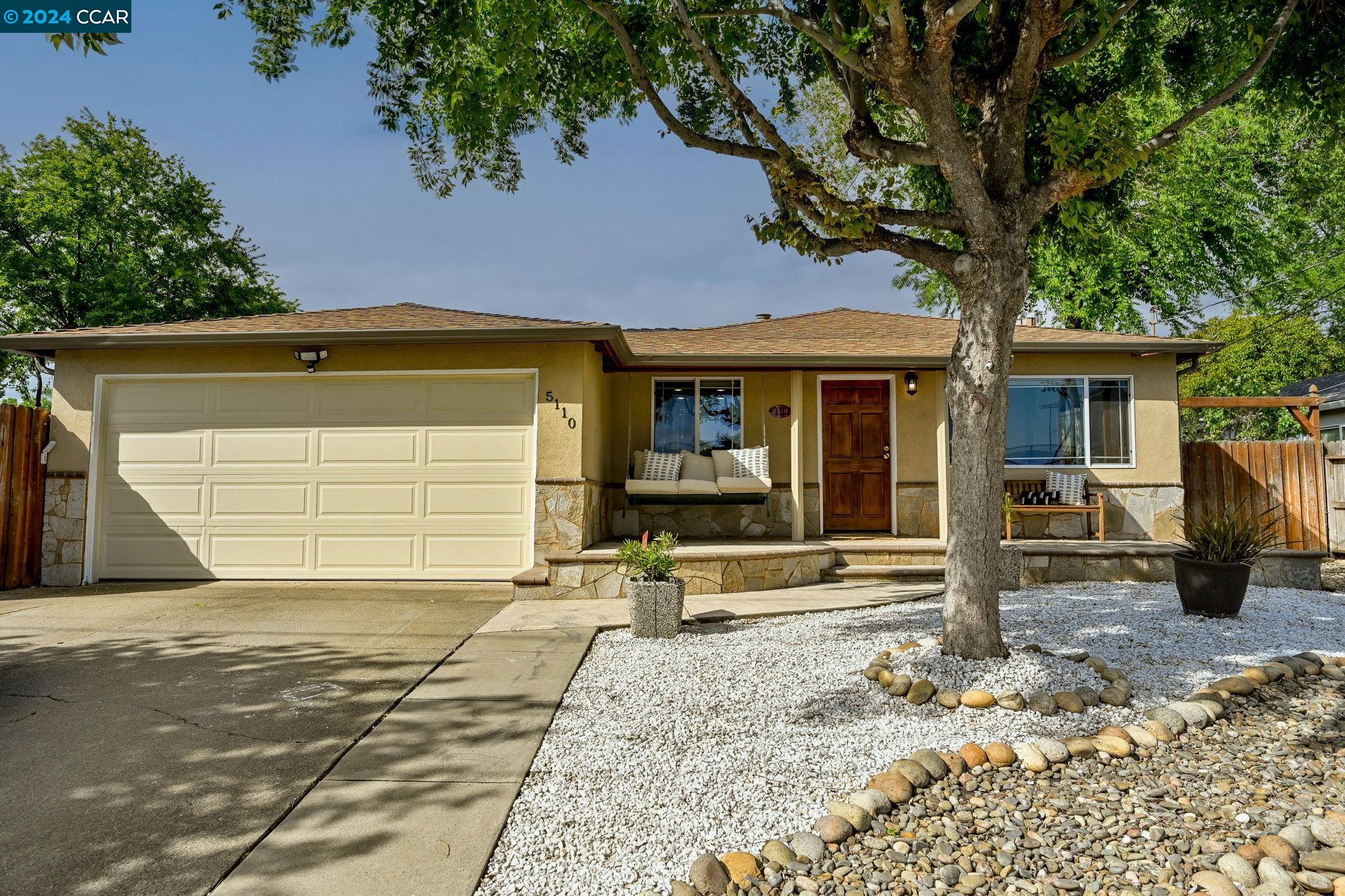 5110 Academy Road Concord, CA 94521 - Photo 1 of 1 a front view of a house with garden