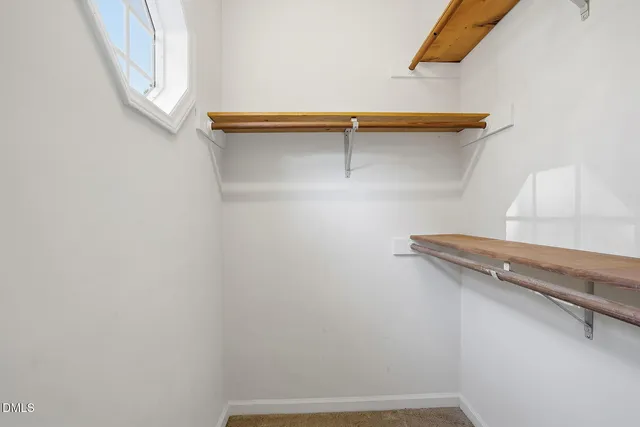 a view of a room with racks on the wall