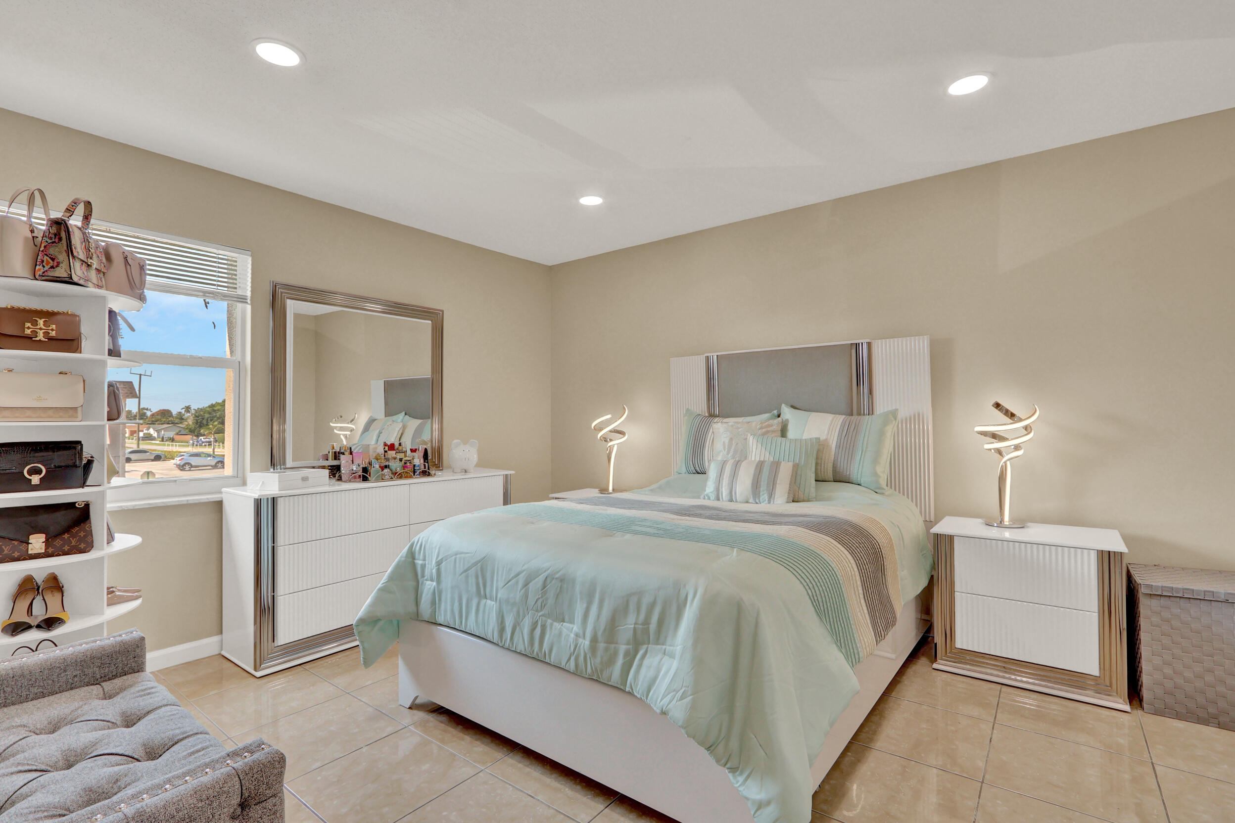 502 Davis Road, Unit 12 Palm Springs, FL 33461 - Photo 4 of 23 a bedroom with a bed and a couch