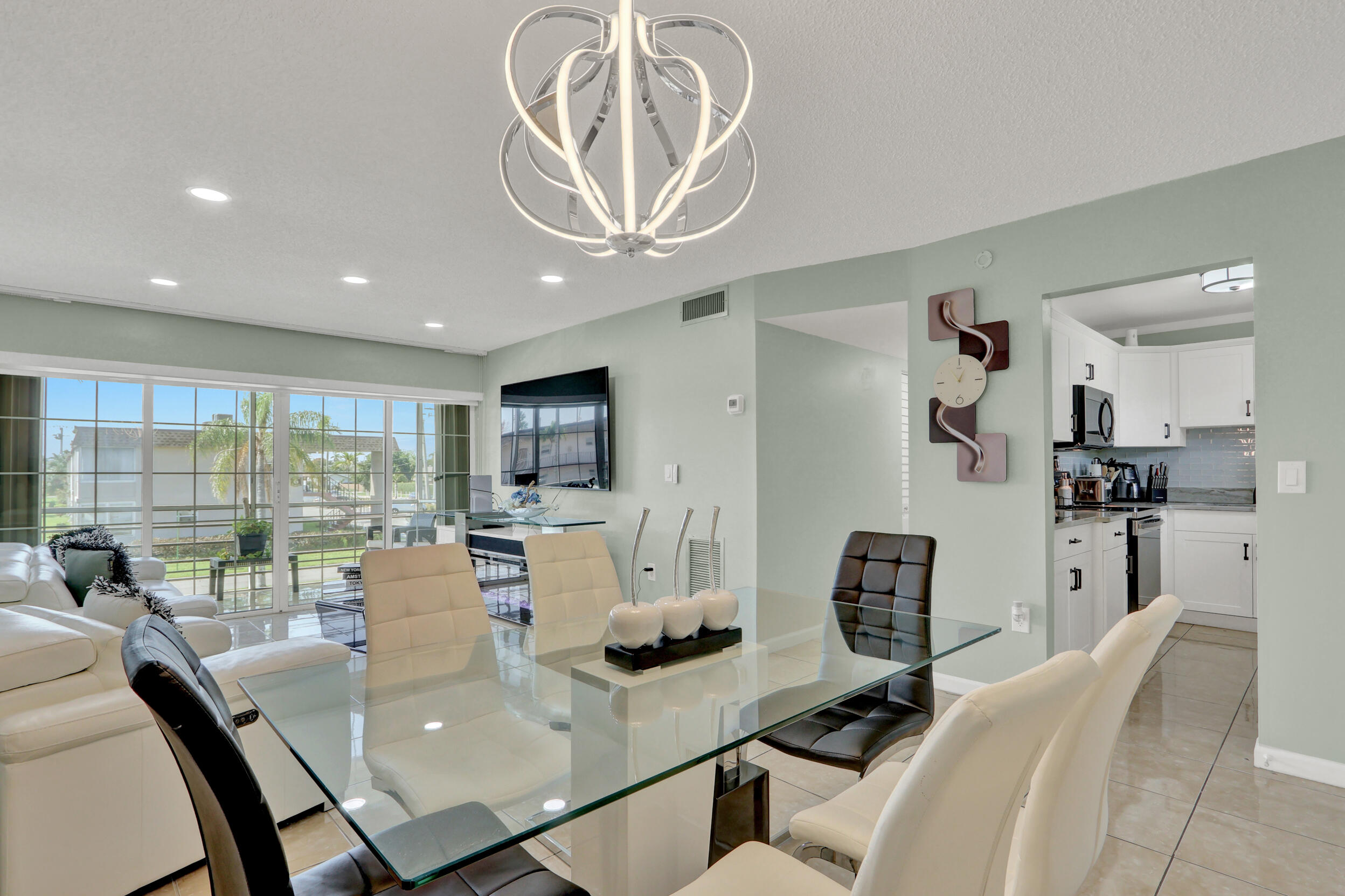 502 Davis Road, Unit 12 Palm Springs, FL 33461 - Photo 7 of 23 a view of a dining room with furniture window and outside view