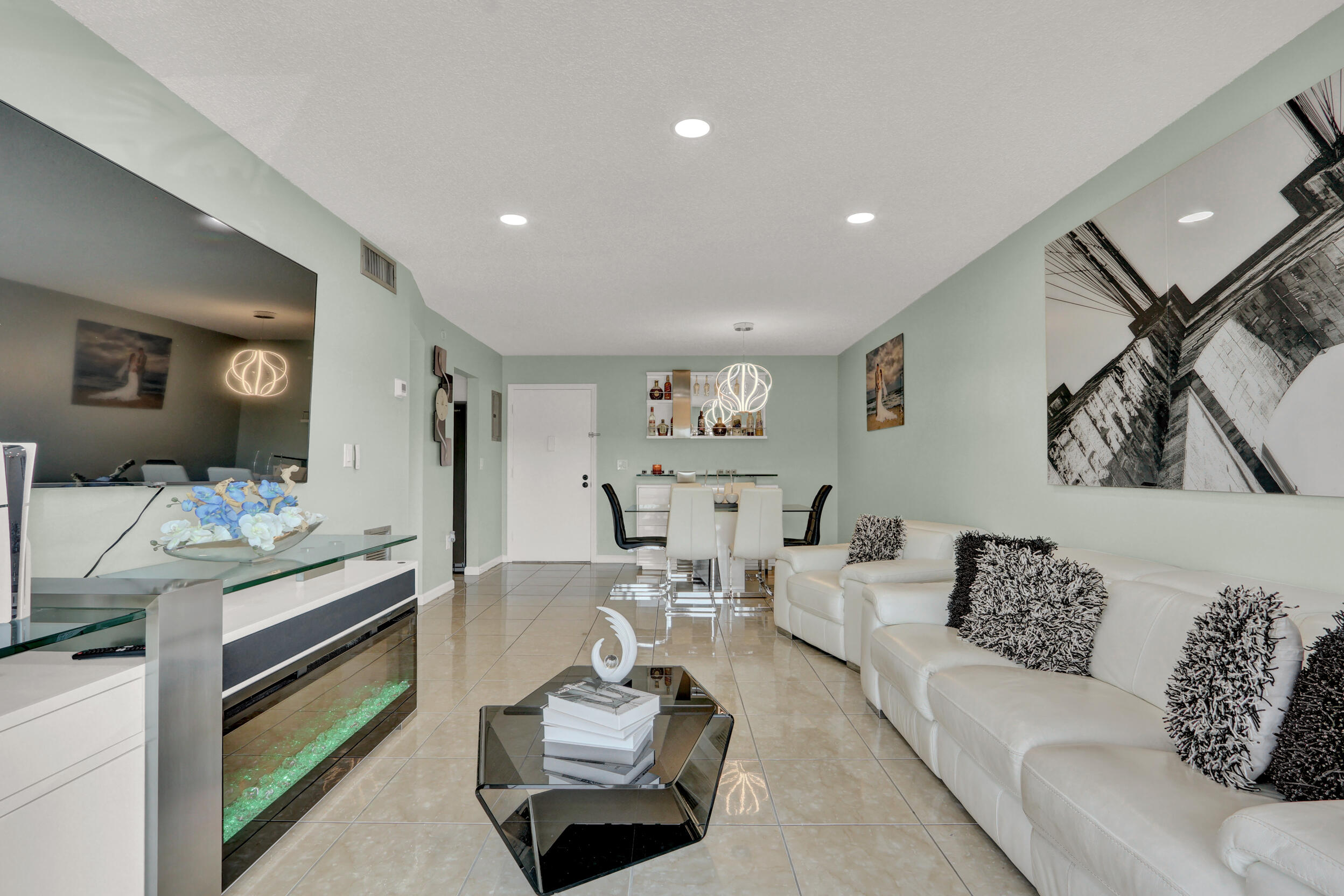 502 Davis Road, Unit 12 Palm Springs, FL 33461 - Photo 9 of 23 a living room with furniture and wooden floor