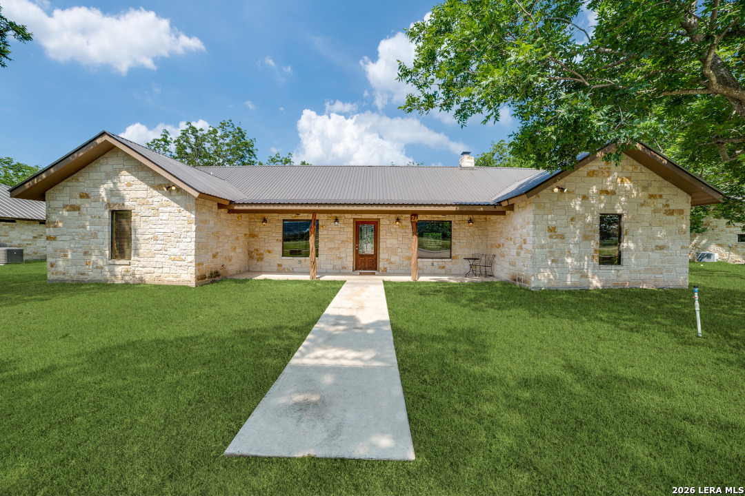 170 Johhny Seibert Lane Rio Frio, TX 78879 - Photo 1 of 50 a front view of a house with a yard and garage