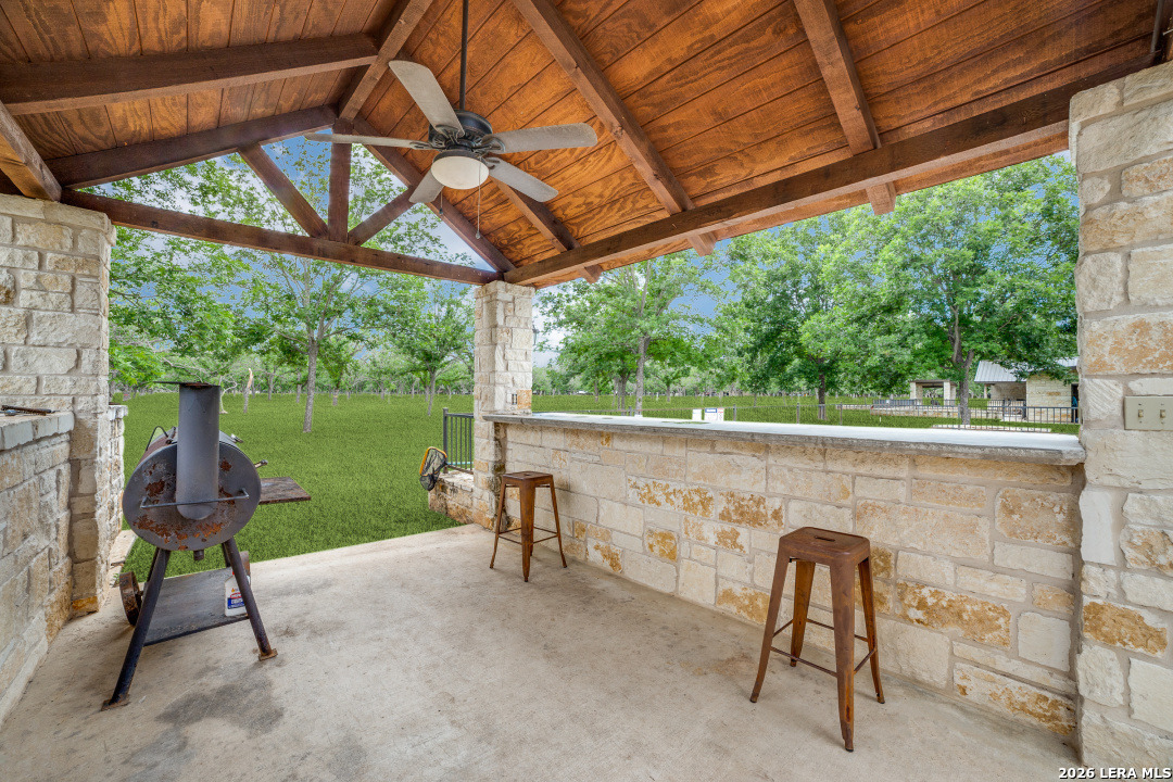 170 Johhny Seibert Lane Rio Frio, TX 78879 - Photo 20 of 50 a view of a patio with table and chairs next to a yard
