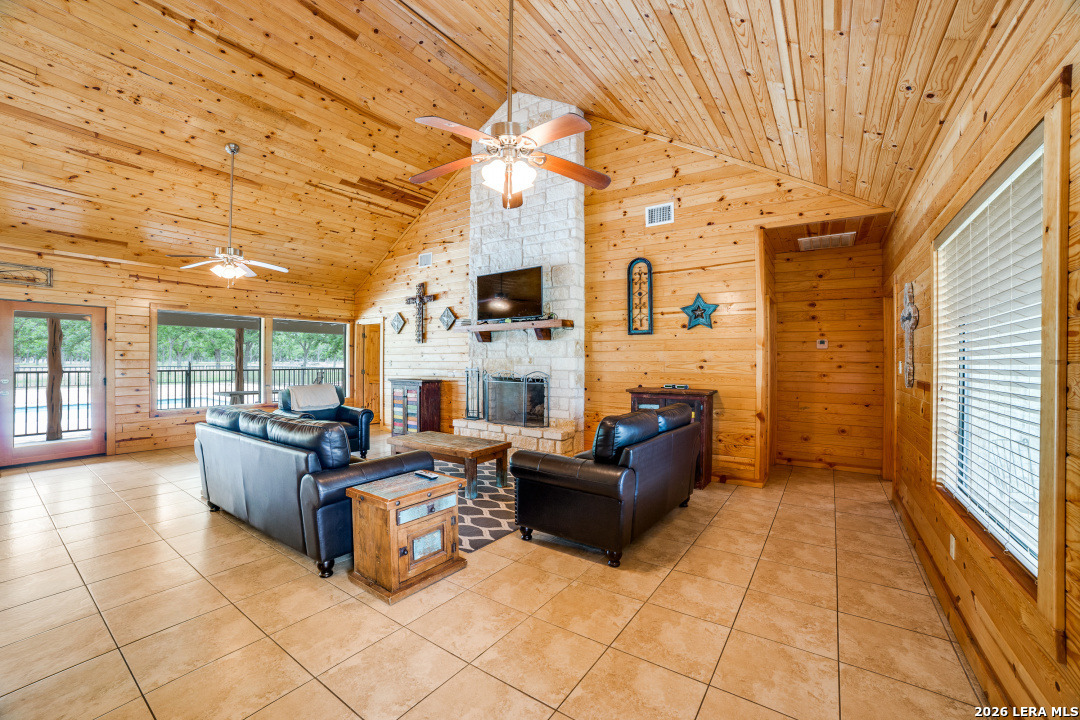 170 Johhny Seibert Lane Rio Frio, TX 78879 - Photo 29 of 50 a living room with fireplace furniture and a large window