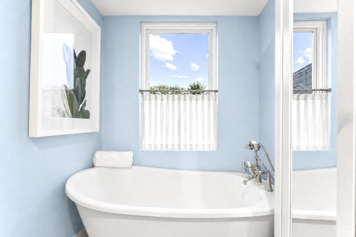 1627 Montello Avenue Northeast Washington, DC 20002 - Photo 13 of 15 a white bath tub sitting next to a window