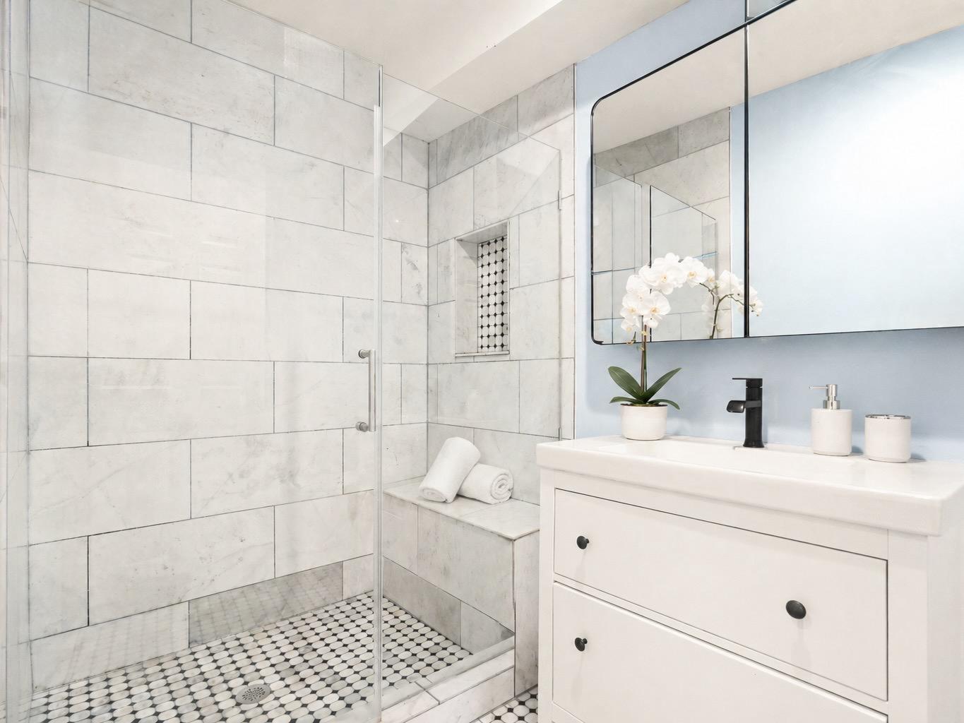 1627 Montello Avenue Northeast Washington, DC 20002 - Photo 14 of 15 a bathroom with a sink a vanity and a mirror