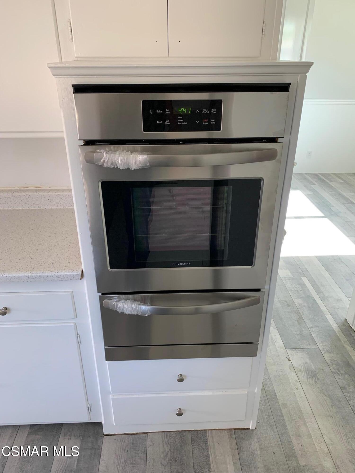 4139 Cochran Street Simi Valley, CA 93063 - Photo 4 of 21 a stove top oven sitting inside of a kitchen