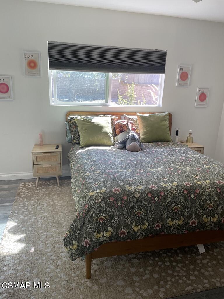 4139 Cochran Street Simi Valley, CA 93063 - Photo 10 of 21 a bed sitting in a bedroom next to a window