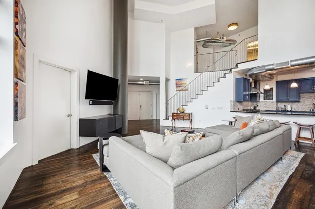 a living room with furniture and a flat screen tv