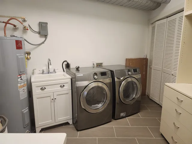 a utility room with dryer and washer