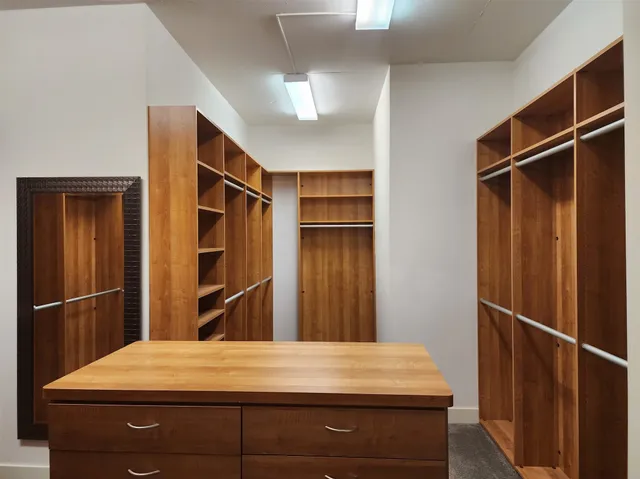 a room with closet and wooden floor