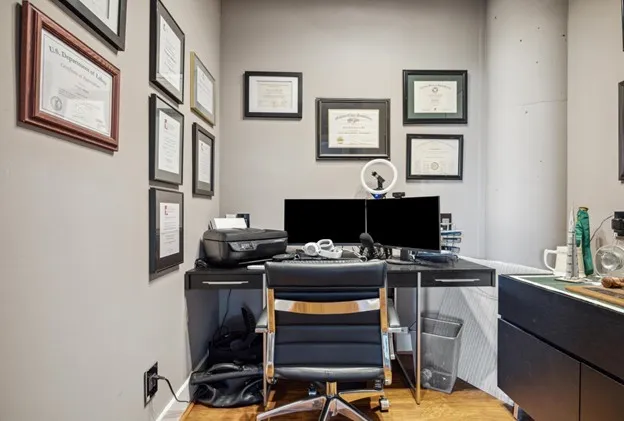 a view of a workspace with furniture