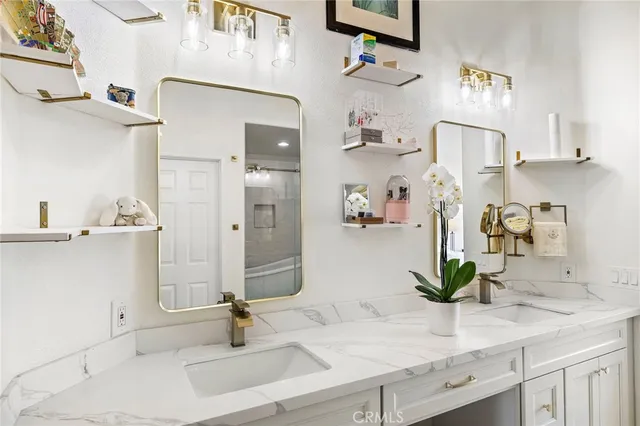 a bathroom with a sink and mirror