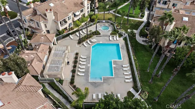 an aerial view of a residential houses with outdoor space