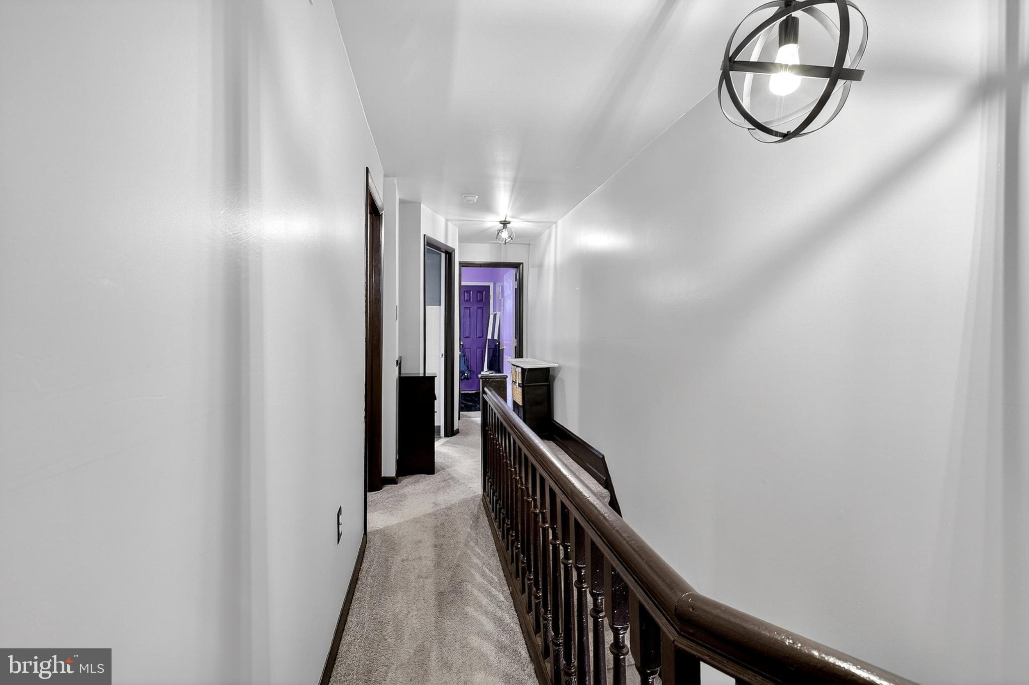4824 Regent Street Philadelphia, PA 19143 - Photo 20 of 22 Elegant hallway with modern lighting accents.